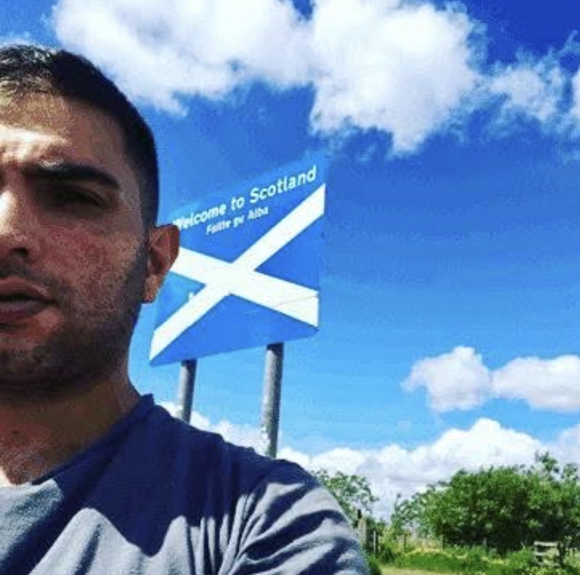 Bank Oliday at the Welcome to Scotland sign